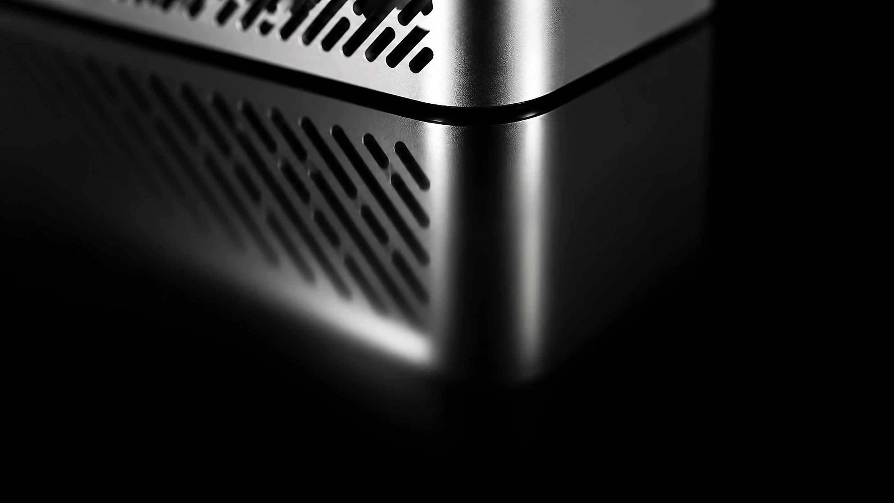 Close-up of the Zuture unit's perforated aluminium air-intake grille wrapping around a rounded corner